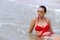 Woman red bikini and sunglasses relax water on beach