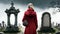 Woman in a red coat in a cemetery, among the graves