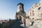 Woman in red coat discovering Lubovniansky Hrad castle ruins in Stara Lubovna, Slovakia