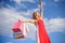 Woman red dress carries bunch shopping bags blue sky background. Feel free buy everything you want. Finally bought