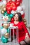 Woman in red dress with Christmas cake. Inscription Good Christmas. Happy holiday concept