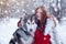 Woman on red dress with dogs. Fairy tale girl with Huskies or Malamute. Christmas