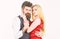 Woman in red dress and man in vest. Dancing couple concept. Bearded hipster and attractive lady dressed up for dancing