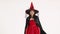 Woman in red female witch costume.