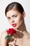 Woman with red flower Bare shoulders pure luxury leather red lips