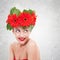 Woman with red gerbera flowers on her head