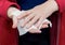 A woman in red her hands with an antiseptic napkin. Personal hygiene.