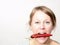 Woman with red hot chilli pepper trying to lose weight with eating healthy food stock photo