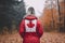 A woman in a red jacket with a canadian flag on it. Generative AI image.