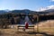 Woman in a red jacket looking at the abandoned ski jump