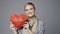 Woman with red low poly paper heart shape