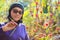 Woman and red roselle plant in agriculture plantation