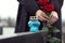 Woman with red roses, focus on candle. Funeral ceremony