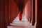 A woman in a red sari in an ancient Indian temple.