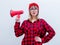 Woman in red shirt and hat with loud shout with megaphone