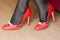 Woman with red stilettos shoes