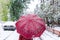 The woman with a red umbrella. The winter has come.