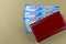 Woman red wallet. Russian banknotes in denominations of 2000 rubles. Payment