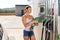 Woman refuelling her car at petrol filling station