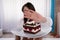 Woman Refusing Slice Of Cake