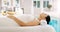 Woman, relax and sleeping on bed at spa for zen, physical therapy or healthy massage at resort. Calm female person