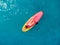 Woman relax on stand up paddle board on a quiet blue ocean