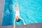 Woman relax in swiming pool on luxury resort