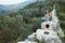 Woman relax in yoga pose at ruins of Delikkemer aqueduct