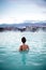 Woman relaxes and enjoys of spa in hot spring Blue Lagoon in Ice