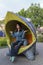 Woman relaxes on a funny bench