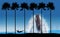 A woman relaxes in a hammock near the ocean with palm trees as a huge whale breachs,