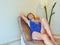 Woman relaxes after wellness in a swimsuit on a golden mosaic stone couch