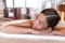 Woman relaxing in bathtub at home taking hot bath wellness alone time. Asian lady happy sleeping in luxury spa hotel