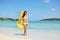 Woman relaxing at the beach, enjoying summer freedom