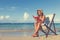 Woman Relaxing on the Beach Tranquil Tropical Concept