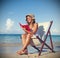 Woman Relaxing on the Beach Tranquil Tropical Concept