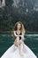 Woman relaxing on a canoe at a lake