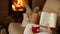 Woman relaxing on couch with warm drink and good book