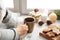 Woman relaxing with cup of hot winter drink near window.