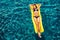 Woman Relaxing Floating on Raft in Pool