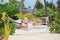 Woman relaxing in a hammock and reading a book on a beach