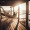 Woman relaxing in hammock on terrace with sea view at sunset