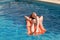 Woman relaxing on an inflatable mattress in pool