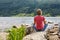 Woman relaxing at lake shore