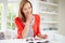 Woman Relaxing With Magazine At Home