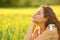 Woman relaxing mind with closed eyes in a field