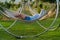 Woman relaxing in a modern hammock on a metal frame