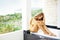 Woman relaxing in outdoor bath on a balcony of resort