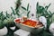 Woman relaxing in outdoor bath with flowers in Bali spa hotel