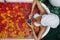 Woman relaxing in outdoor bath with flowers in Bali spa hotel